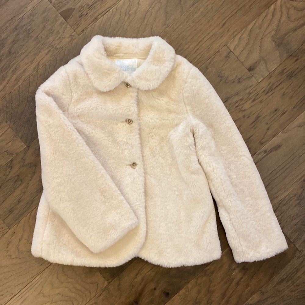 Ivory faux for girl’s coat by Edgehill Collection. Fits generously.